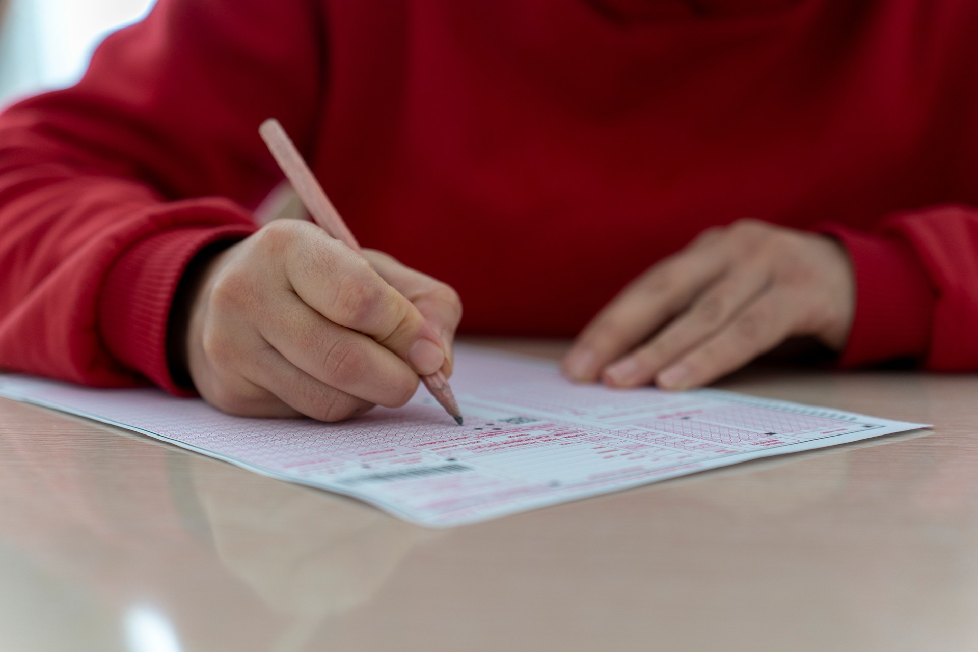 A young girl taking an exam.